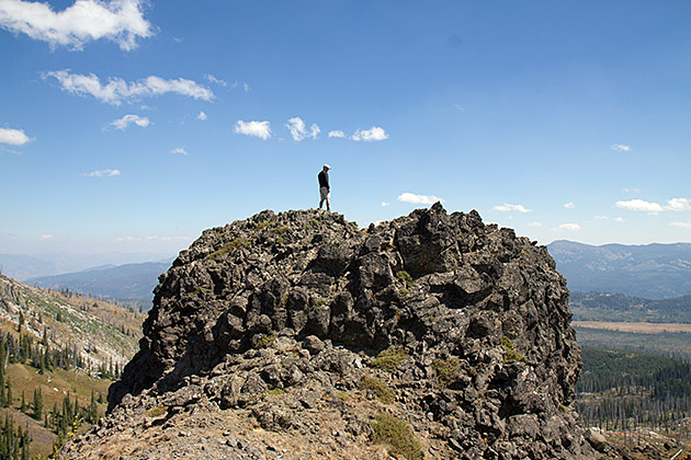 Hiking man on a rock at the Lave Lakes in Payette, Idaho